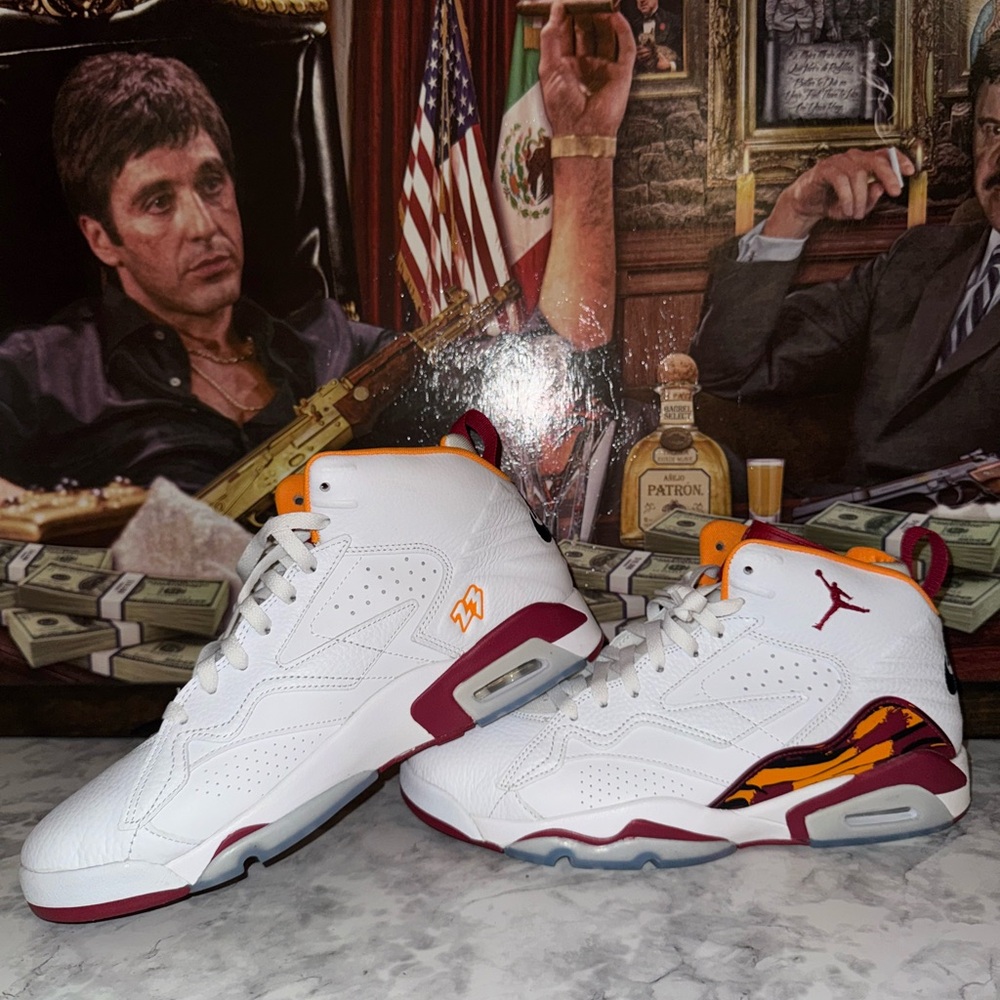 Jordan MVP shoes in the white, cardinal red, and vivid orange color scheme.